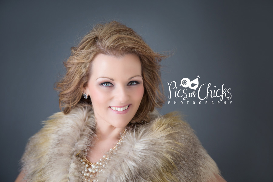 Boudoir Photo with woman in fur vest and pearl necklace.  Pittsburgh Boudoir Photographer - www.PicsByChicksPhotography.com