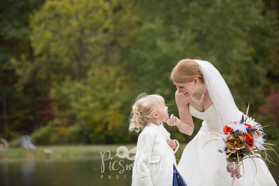 bride & flower girl photo by pond at Squaw Park, Pics By Chicks Photography bride & flower girl photo by pond at Squaw Park, Pics By Chicks Photography