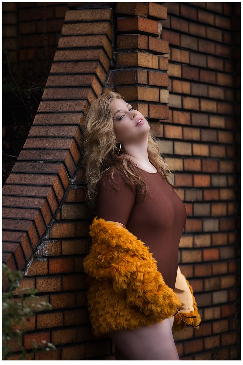 sexy and intimate outdoor boudoir photo of fur jacket and brown bodysuit sexy and intimate outdoor boudoir photo of fur jacket and brown bodysuit