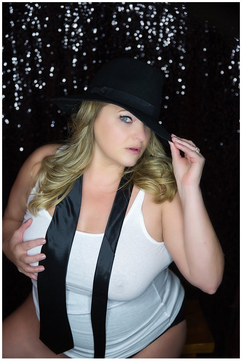 black hat, tie and tank top boudoir photo against sequin background - boudoir photography pittsburgh black hat, tie and tank top boudoir photo against sequin background - boudoir photography pittsburgh