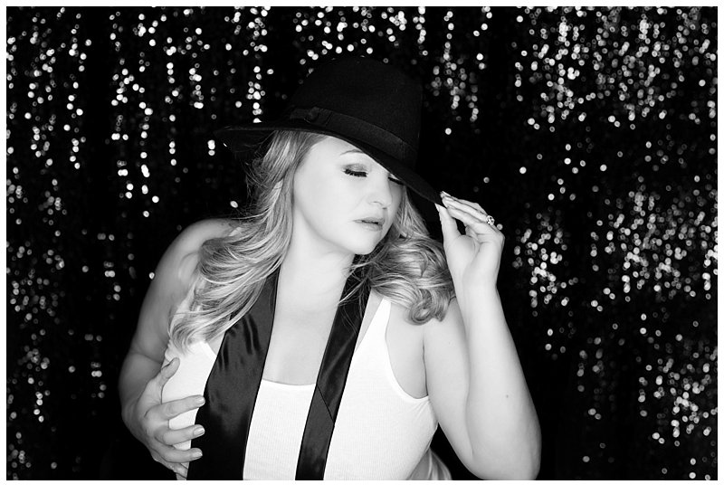 black hat, tie and tank top boudoir photo against sequin background - boudoir photography pittsburgh black hat, tie and tank top boudoir photo against sequin background - boudoir photography pittsburgh