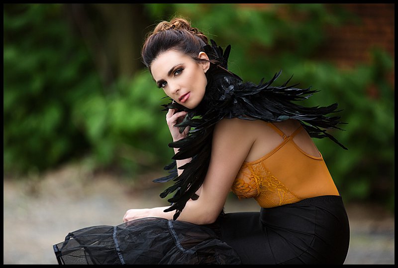 pittsburgh boudoir photography of woman in mustard bodysuit with feather collar pittsburgh boudoir photography of woman in mustard bodysuit with feather collar