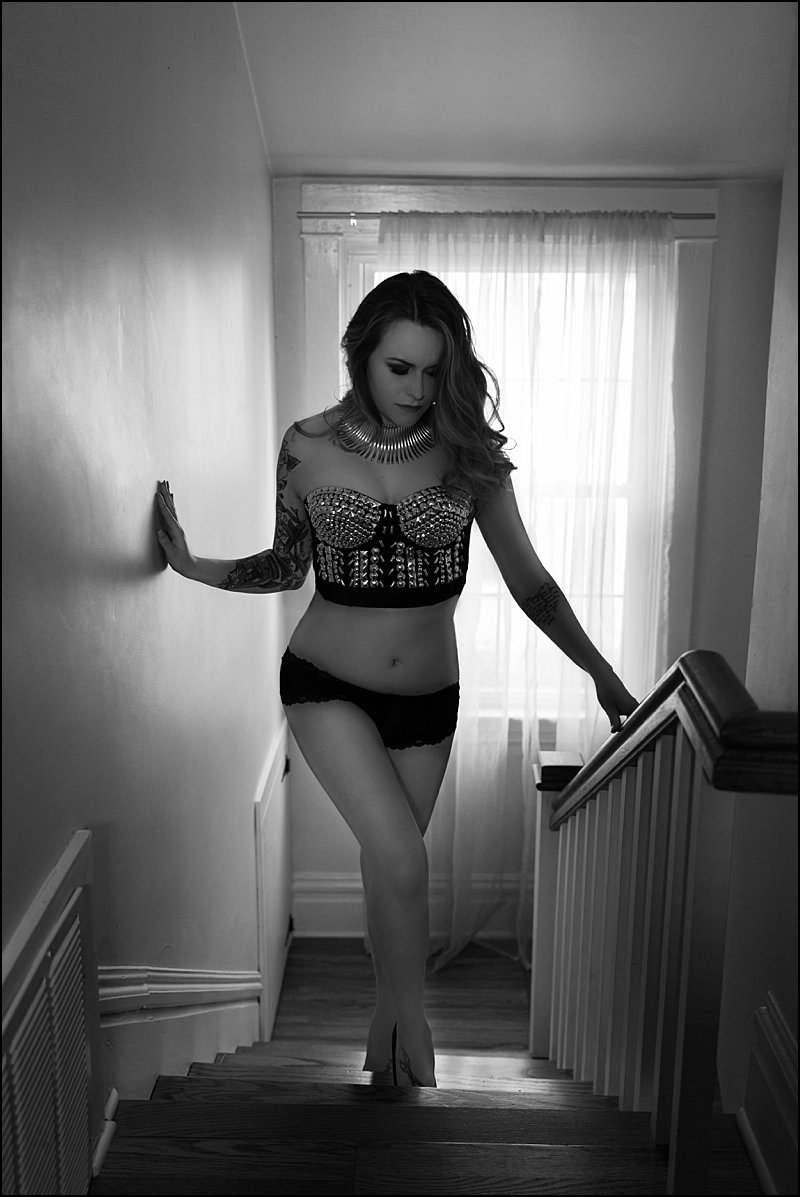 pittsburgh boudoir photos of woman in gold bra and black panty standing on steps pittsburgh boudoir photos of woman in gold bra and black panty standing on steps
