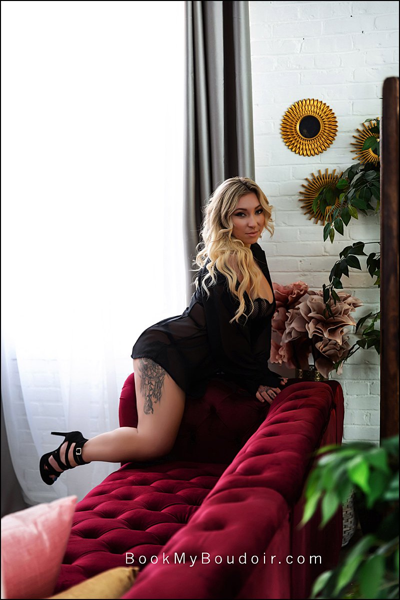 pittsburgh boudoir photo shoot, sexy photo shoot of woman in black sheer shirt on red sofa, Maura Chick Studios, Chick Clique
