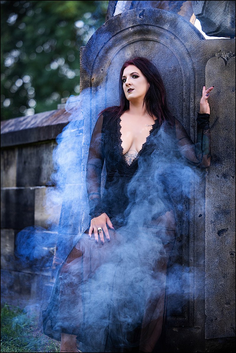 Pittsburgh HalloQUEENS photo shoot with women posing in cemetery with fog in black tulle cape and spider collar, boudoir photography with Maura Chick Pittsburgh HalloQUEENS photo shoot with women posing in cemetery with fog in black tulle cape and spider collar, boudoir photography with Maura Chick